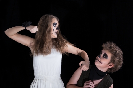 groom and  bride -  zombie, children have put on for Halloween の写真素材