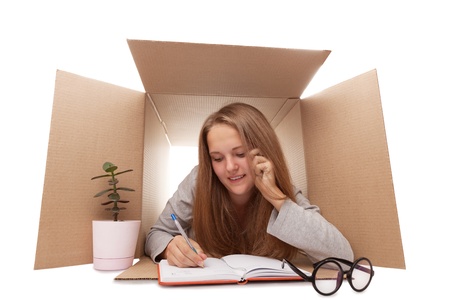 girl has retired to a cardboard box の写真素材