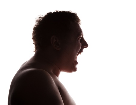 man portrait silhouette profile screaming angry in studio isolated white background の写真素材