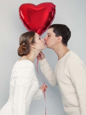 The girl and the guy with balloons in the form of heartの写真素材