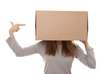  girl and carton box on a white backgroundの写真素材