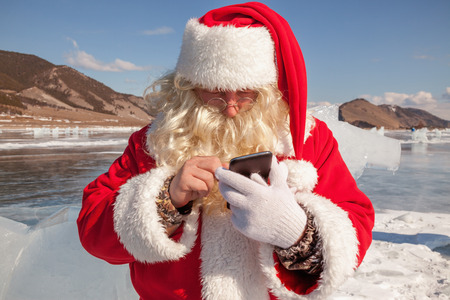 Santa Claus  that calls to whom by phone の写真素材