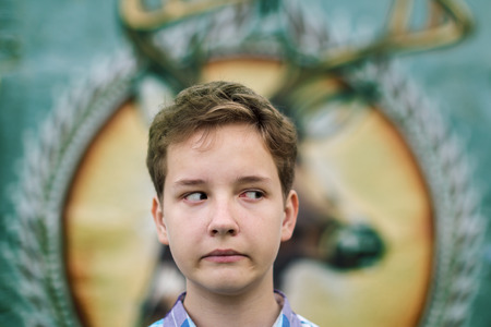 Fun portrait of the teenager boy in outdoorsの写真素材