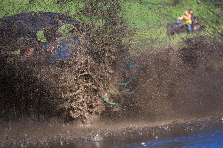 suv splash on the river outdoor ,traveling on the road.