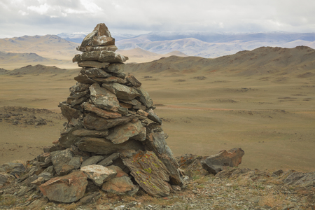 A pile of stones composed for shaman or pagan rituals in Mongoliaの写真素材