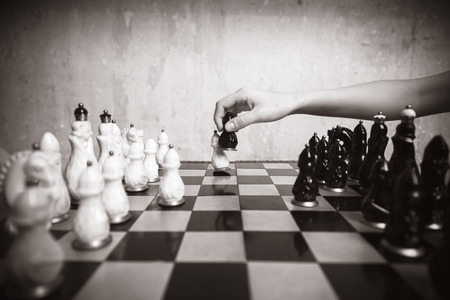 Playing chess, close-up, black-and-white photoの写真素材
