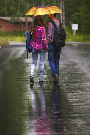 Portrait of happy teenage couple  outdoors in the park.の写真素材