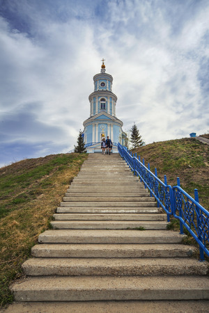 Thelma village, Irkutsk region, Russia - MAY September 2016:? Two students walking down the stairs near the Church of the Kazan Icon of the Mother of God.のeditorial素材