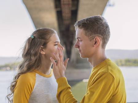 boy and girl, a date under the bridgeの写真素材