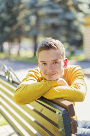 Portrait of a teenager boy in the park  summer dayの写真素材