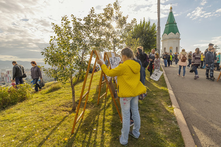 Krasnoyarsk, Russia - September 03 2016: Children draw on the food festival "Summer Kitchen"  on the mountain Pokrovskayaのeditorial素材