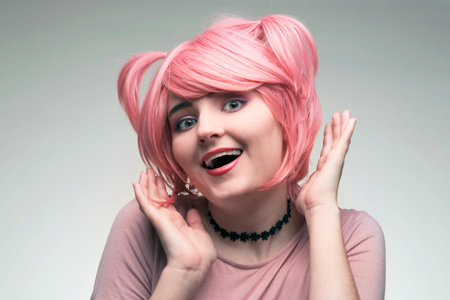 Portrait of girl in pink wig