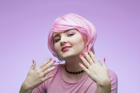 Portrait of girl in pink wigの写真素材