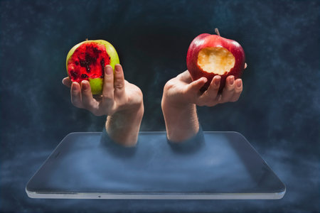 The temptation of knowledge, Internet access. Hand with an apple in a smartphone