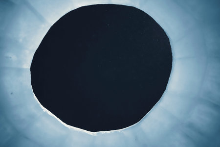 Roof hole made of ice through which the night sky is visible