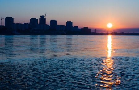 City on the river  in sunriseの写真素材