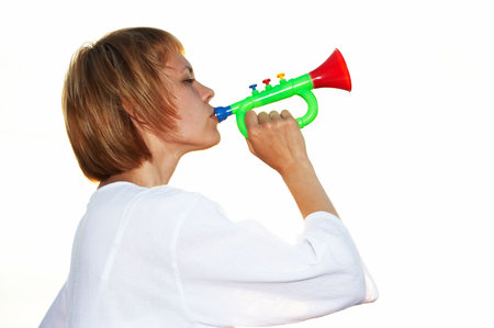 young girl play horn on white