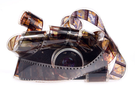 old photo camera with film on white background