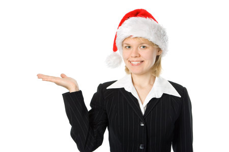 business woman with hand palm up in red santa hat over white backgroundの写真素材