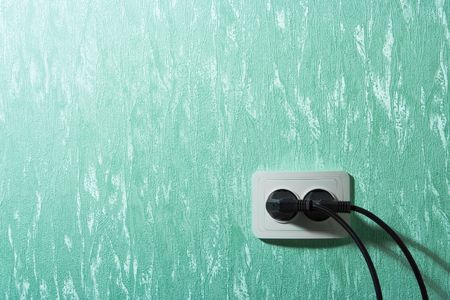 Wall outlets on the green wallの写真素材