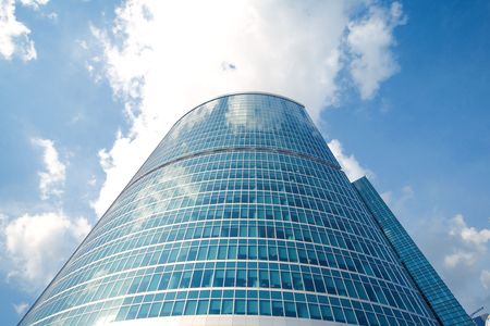 glass building with sky and cloudsの写真素材