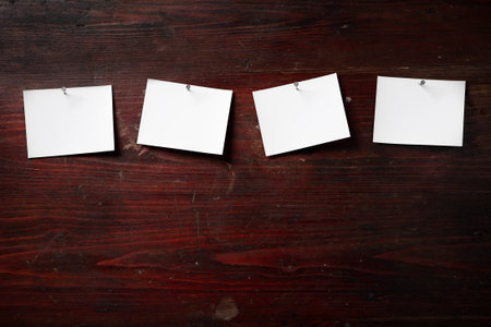 Photo paper attach nail wooden backgroundの写真素材