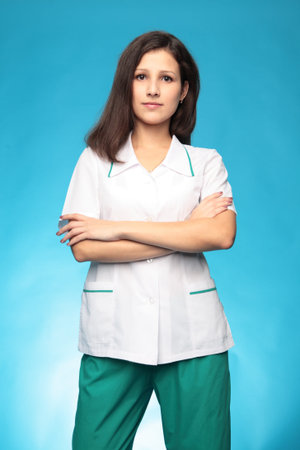 portrait of a doctor on blue backgroundの写真素材