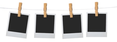 old photo frame palaroid attach to rope clothes peg over white backgroundの写真素材