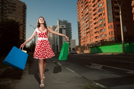 beauty woman in city with color bagsの写真素材