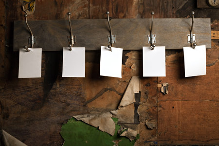 five photo paper attach to hook on desk