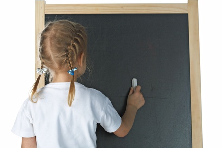 Little girl with blackboard on white backgroundの写真素材