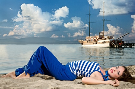 beauty woman on sea with shipの写真素材
