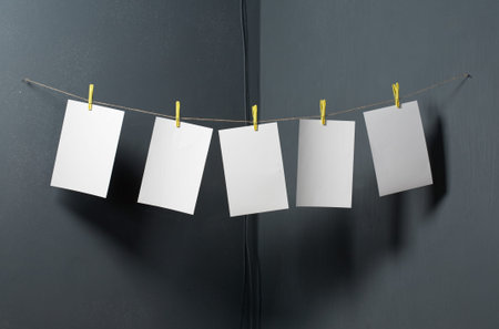 white photo paper on gray backgroundの写真素材