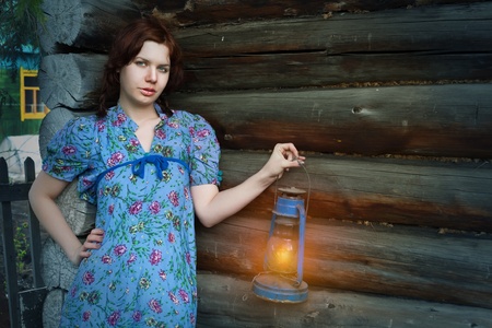 beauty woman in vintage dress on wooden backgroundの写真素材