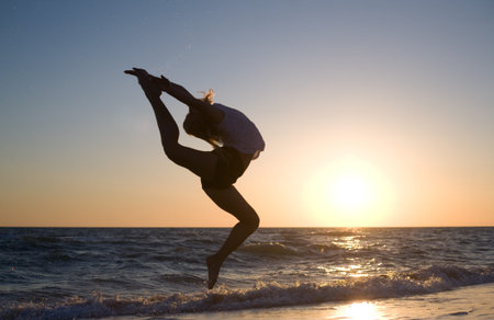 beauty woman at sea in sunset