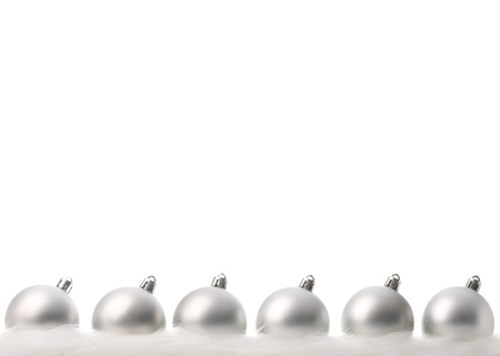 silver christmas balls with snow isolated on whiteの写真素材