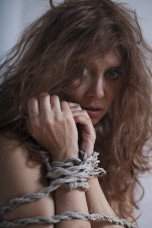 beauty redhaired woman bondage ropeの写真素材