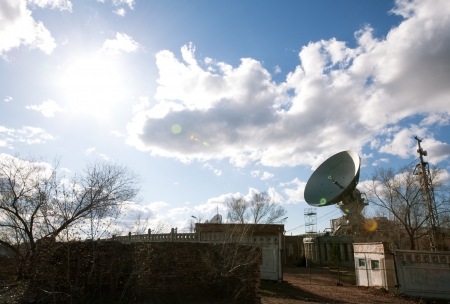 view of satellite dish with sunの写真素材