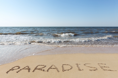 sea beach with sand word paradiseの写真素材