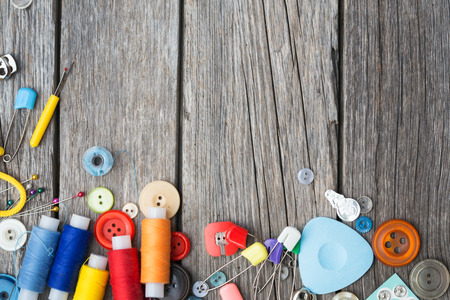 thread and sewing on wooden boards の写真素材
