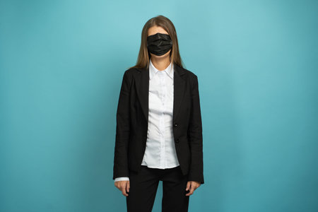 Beautiful Adult Business Woman In Black Suit And White Shirt In Protective Mask On Her Face Against...