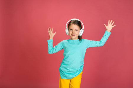 Little Beautiful Baby Girl Pink Background Bright Clothes Yellow Pants Turquoise Blue Shirt Wearing...