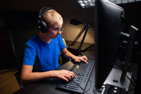 Caucasian Young Teen Guy Plays Games On Computer And Streams The Games Live. Participates in the...