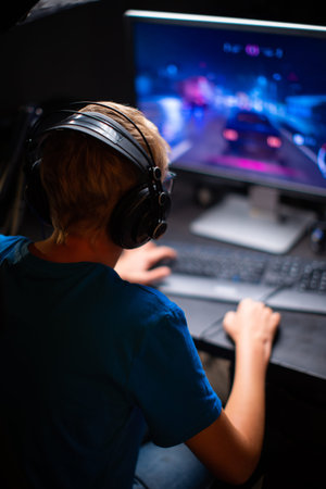 Caucasian Young Teen Guy Plays Games On Computer And Streams The Games Live. Participates in the...