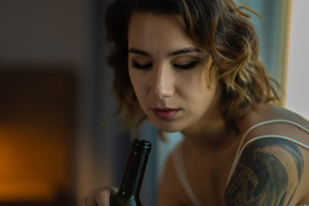Drunk Woman In Depression Is In The Bedroom And Suffers From Anxiety Drinks Alcohol Wine Alone At Homeの写真素材