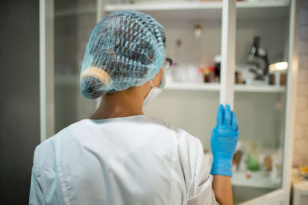 Female Medical Worker Conducting Laboratory Analyzes Examining Viruses And Other Human Diseasesの写真素材