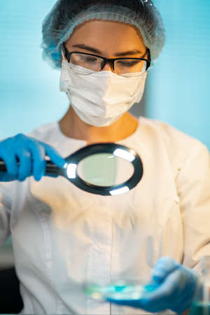 Female Medical Worker Conducting Laboratory Analyzes Examining Viruses And Other Human Diseasesの写真素材