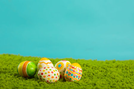 Easter background with cracked eggs green grass blue sky