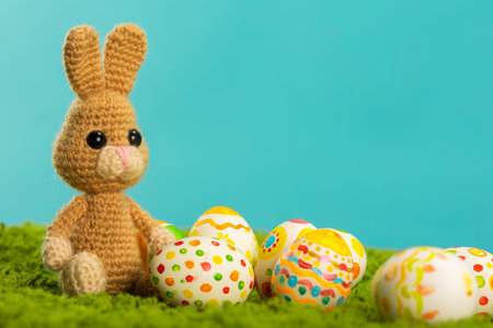 Easter background with cracked eggs green grass blue sky and easter bunny