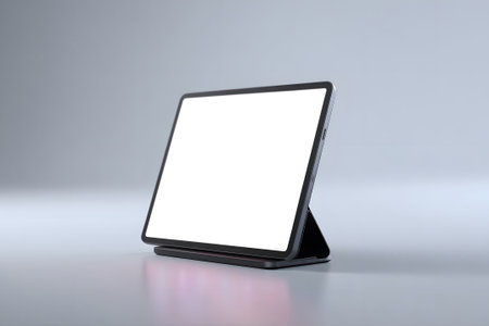 A sleek digital display stand is set on a flat surface, showcasing a blank screen. This setup is ideal for presentations or promotional displays in indoor environments.の素材